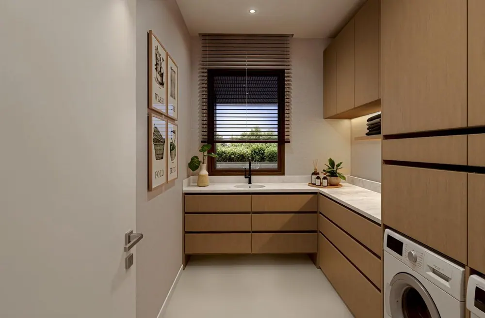 Laundry room with custom wood cabinetry and stone counters
